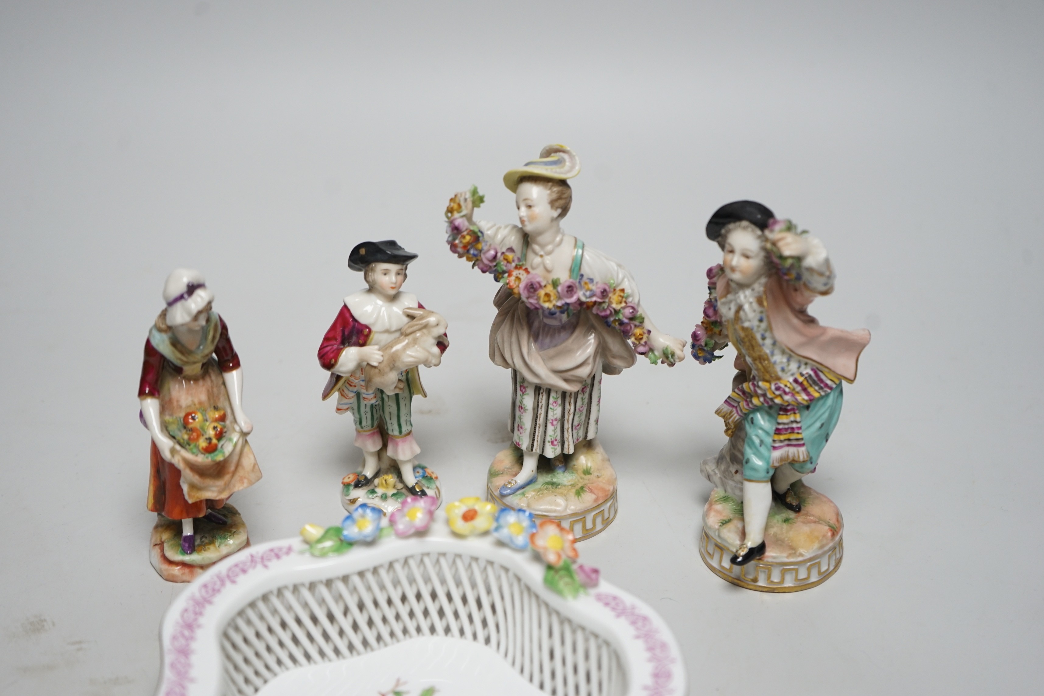 A Herend basket dish and two pairs of Continental figures